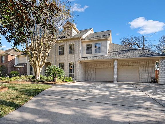 Huge oversized two Car Garage with lots of storage space and shelving - a dream garage.