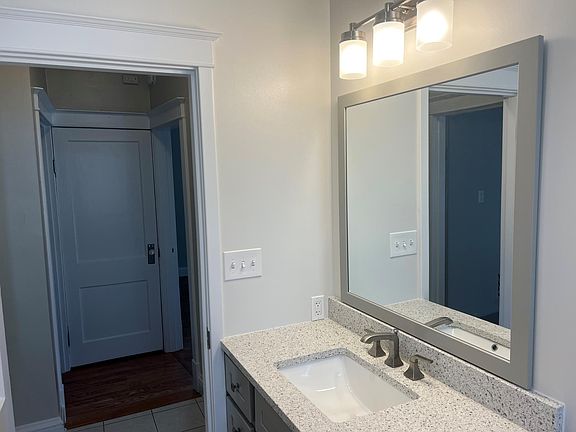 Updated bath with quartz tops and custom shower
