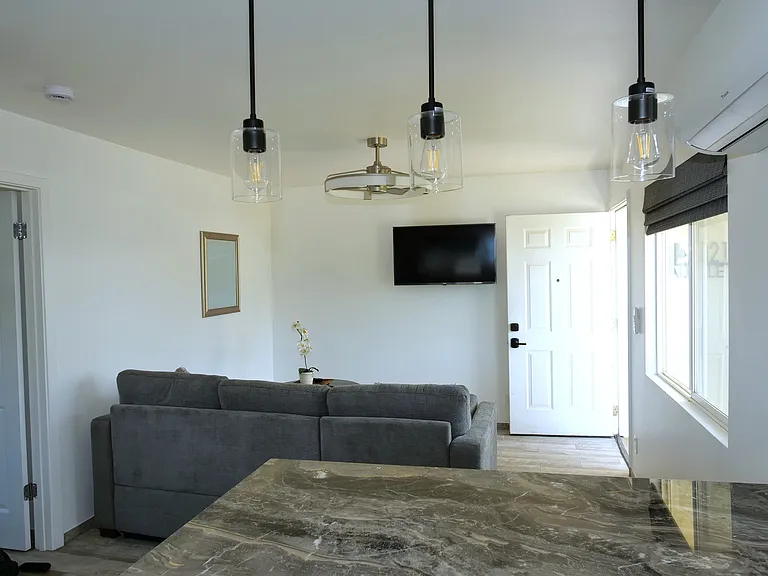 Bright airy with AC, fan, and TV