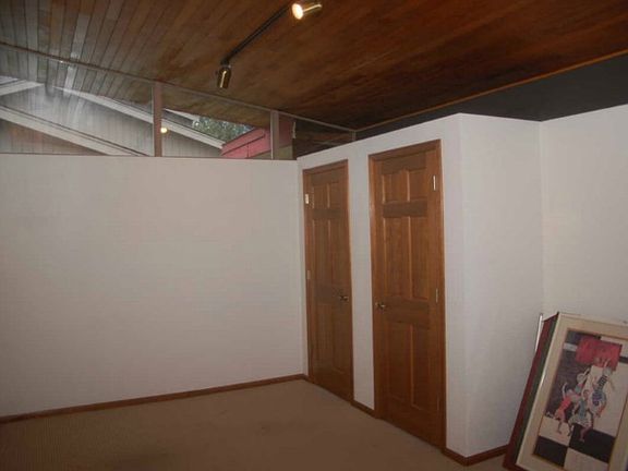 Family room with lots of storage and vaulted ceilings with great windows!