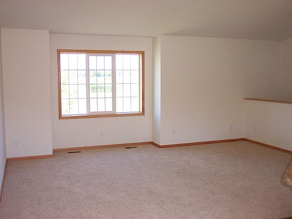 This Living Room is very large and features a large picture