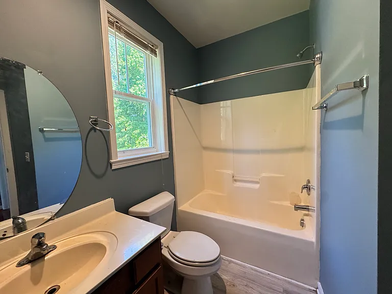 The first bathroom features everything you need with a well-maintained tub/shower combo, vanity, and toilet.