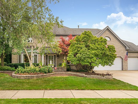 Professionally landscaped home with 3 car garage