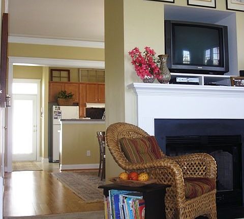 The living room has a fireplace &* the dining room has hardwood floors. 