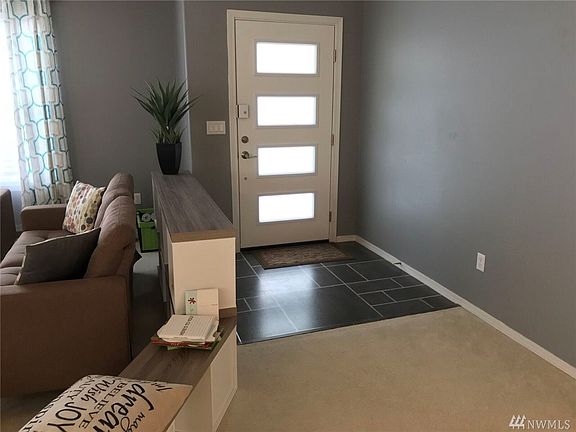 So many upgrades in this house, look at all of the light from the new modern front door