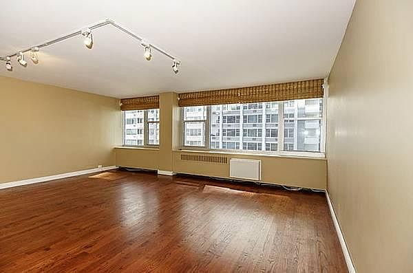 Large Living Room with Hardwood floors and mood lighting
