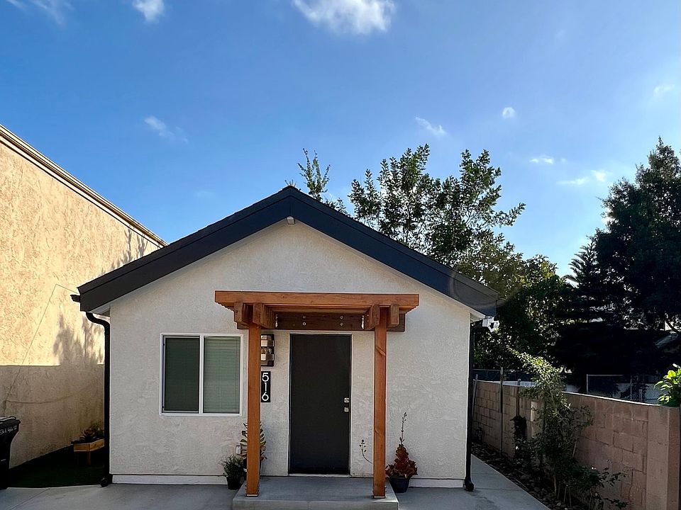 Exterior of home with dusk to dawn lighting through out the exterior of the home.