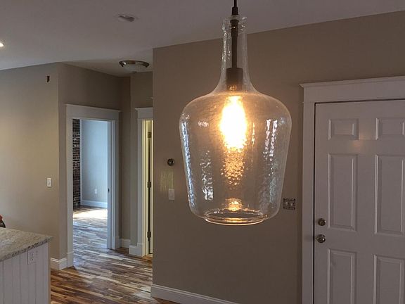 Dining room light looking into a bedroom