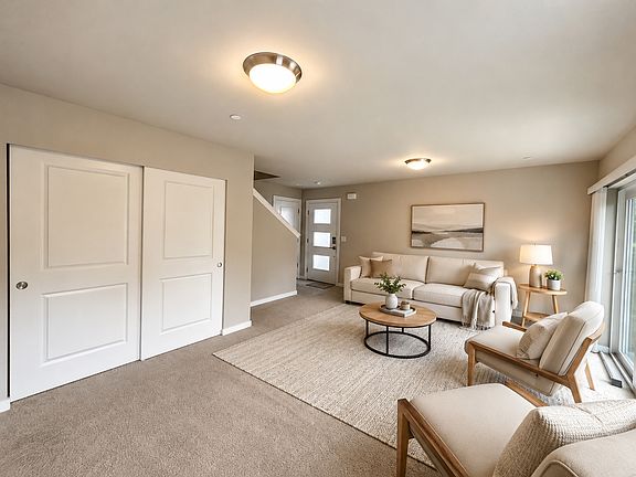 First floor bonus/flex room with slider to patio. Virtually staged.