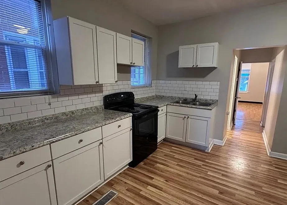 Clean, refreshed kitchen with ample cabinet space - 3829 S Compton Ave #B
