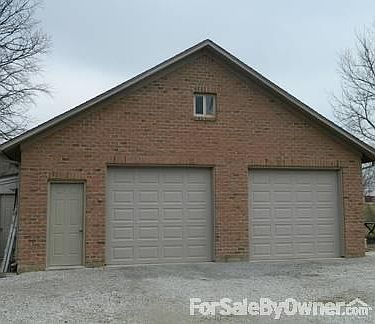 detached garage with entertainment room
						:
						block and brick garage