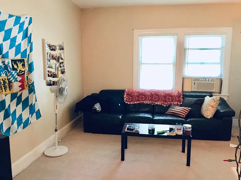Living room (now) has hardwood floors.