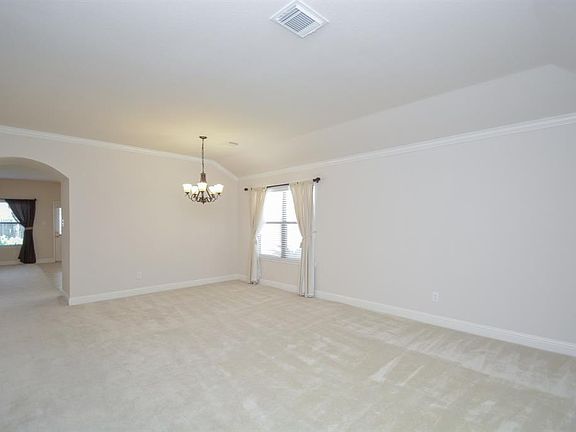 The open living and dining rooms offer flexibility for utilization of your furnishings.