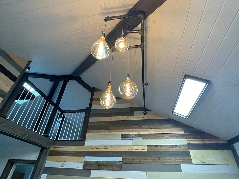 Vaulted ceilings with beautiful fixtures and beams!