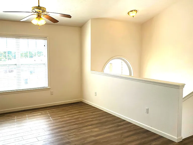 Living Room with New Flooring & New Paint Throughout.