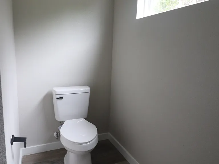 Separate toilet area offering privacy and modern design.