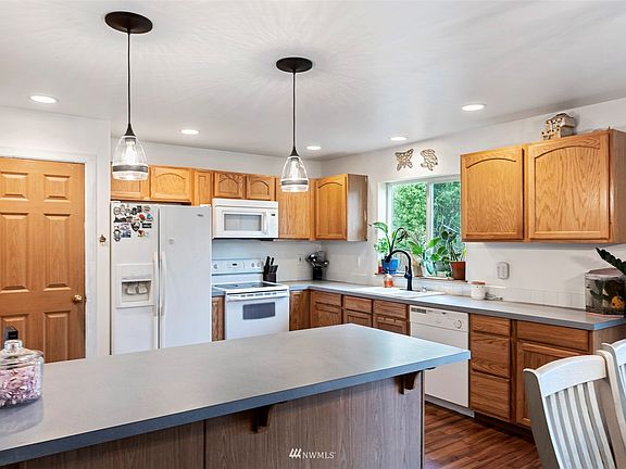 Tons of countertop space in this generous-sized kitchen.