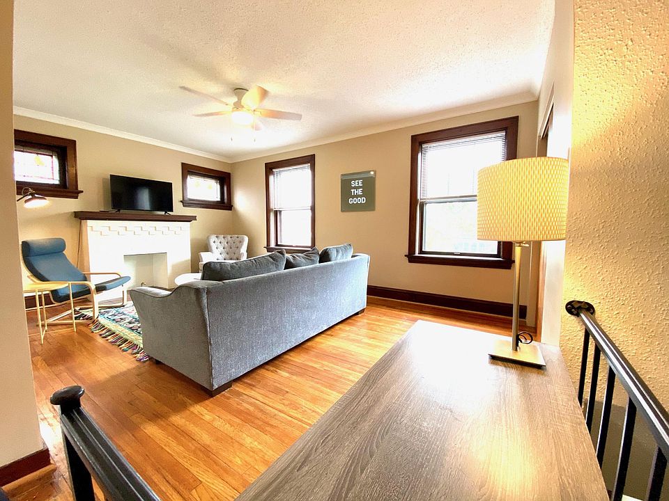 Living room with large closet on the right and sleeper sofa.