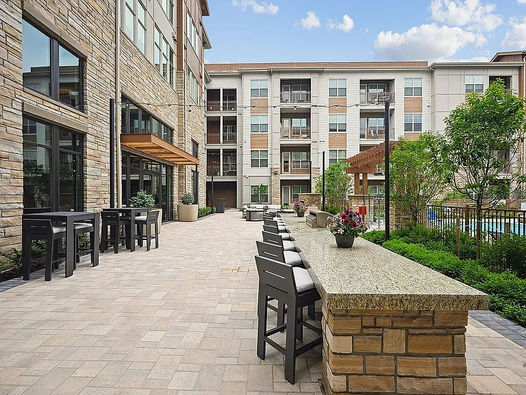 Cook, dine, and relax in our open-air grill and seating area.