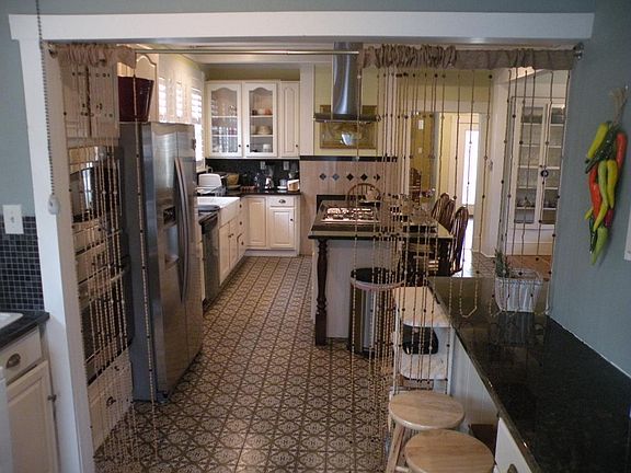 kitchen with granite island and cooktop