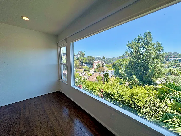 Custom roller blinds throughout.