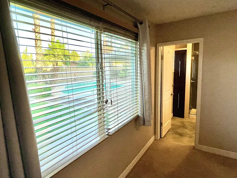 Beautiful view of the backyard and pool from the master window