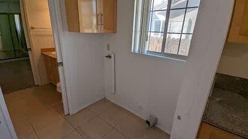 laundry room adjacent to kitchen