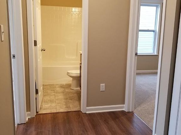 Hall bath flanked by 2nd and 3rd bedrooms