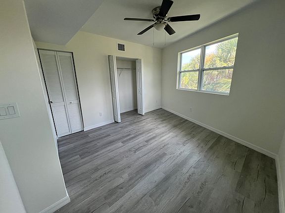 Bedroom with closet and separate closet for central AC