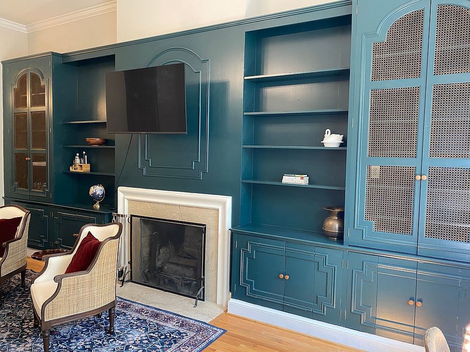 Wall of built-ins and working fireplace