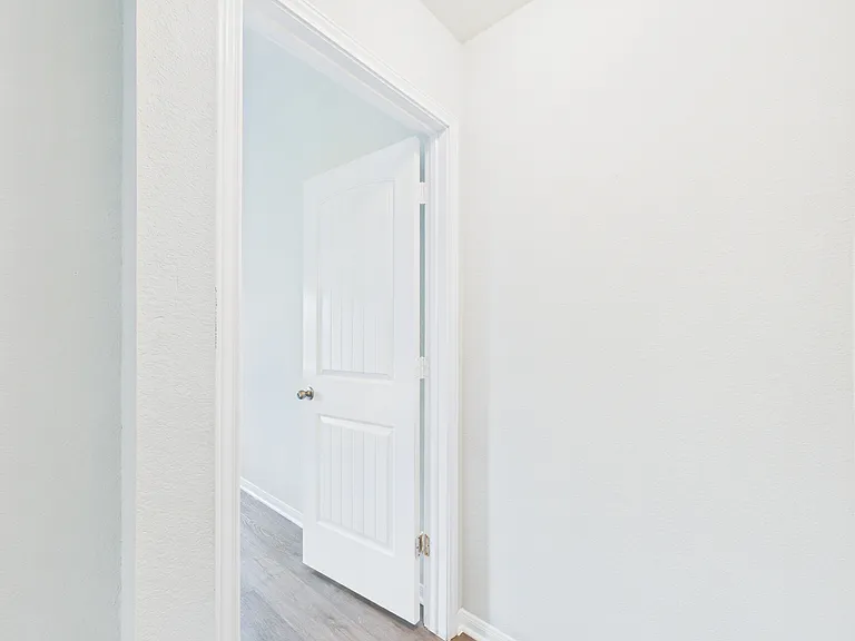 Hallway to primary bedroom