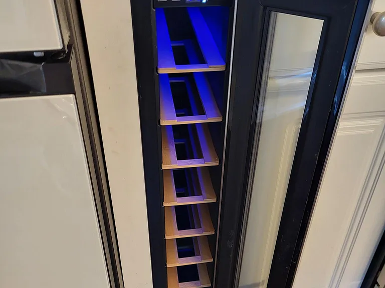 Kitchen includes 7 bottle wine fridge.