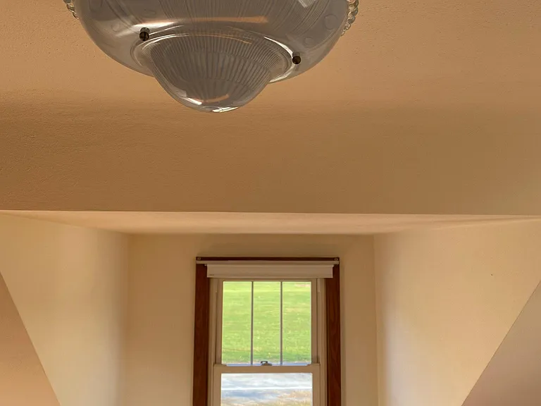 Beautifully restored vintage fixtures in bedrooms.
