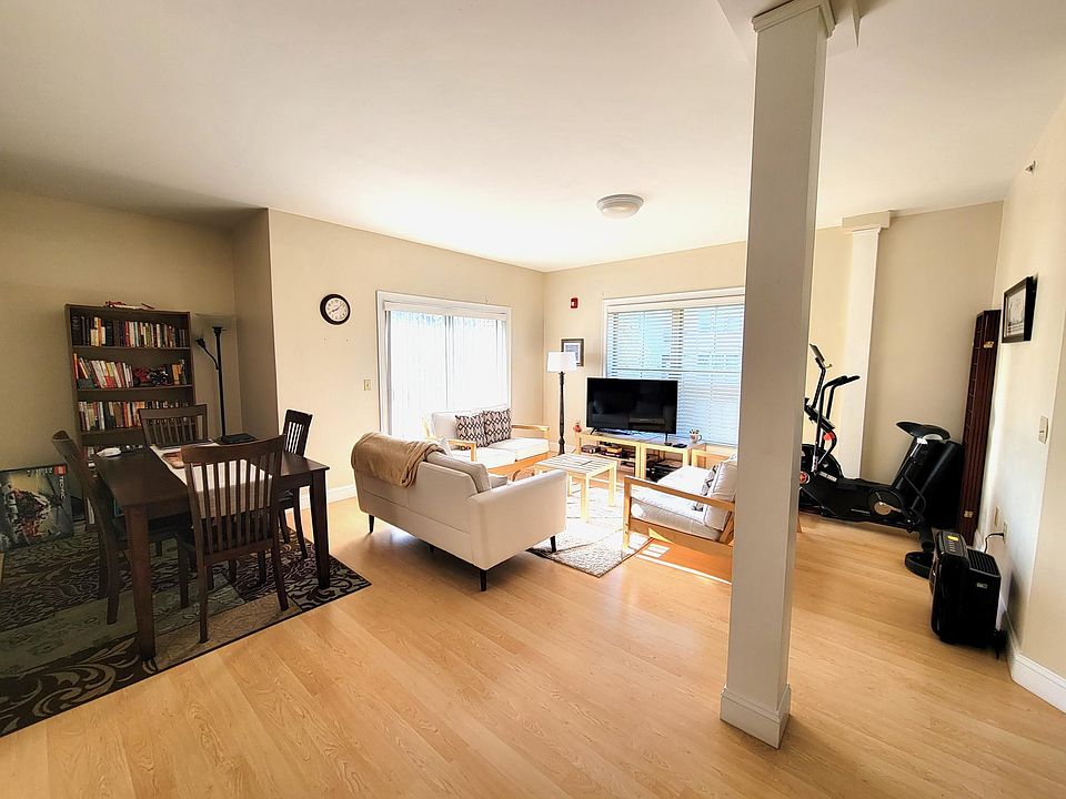 Living room and dining with slider to balcony