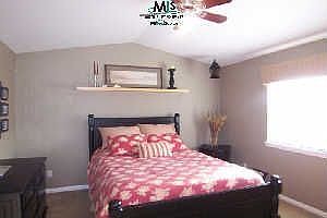 Master bedroom with vaulted ceiling