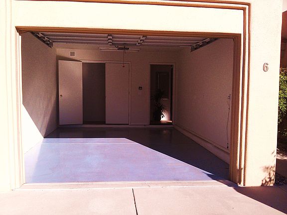 Finished garage with small storage room