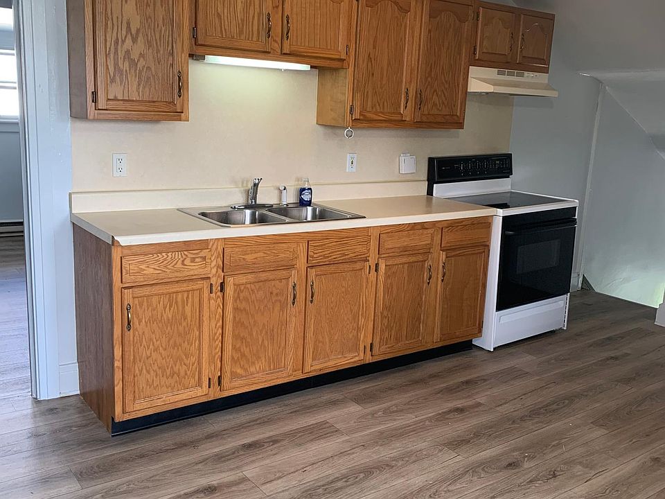 Kitchen with stove and refrigerator.