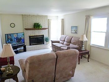 Enjoy the tremendous view of the Lake from the Living Room as you warm yourself in front of the Gas Log Fireplace