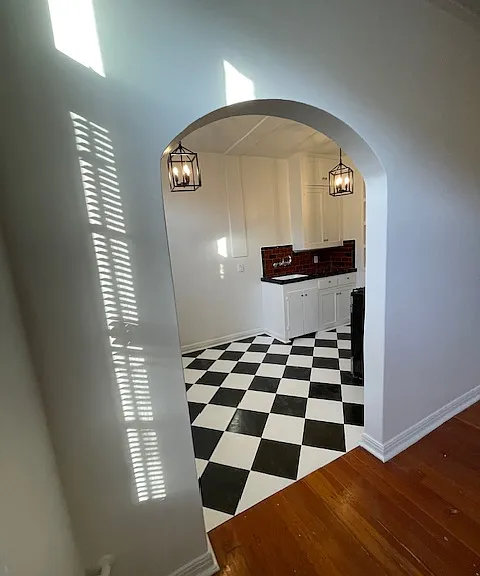 102 kitchen with brand new floor and lighting and gas range