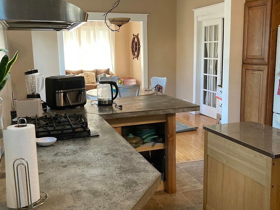 Open concept kitchen, dining room and living room