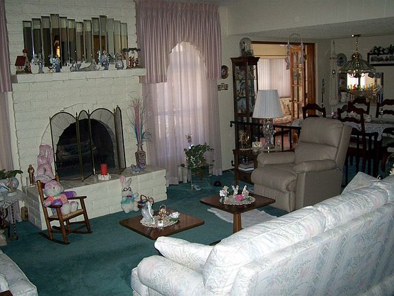 Sunken Living Room w Brick Hearth 