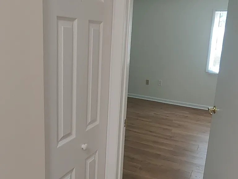 Linen closet in the hallway. View of the master bed