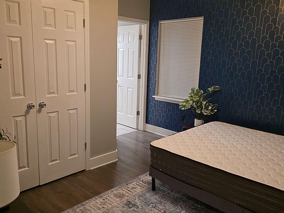 Bold Accent wall, Memory foam Queen bed, Dresser, TV, Large closet. 
Final images coming soon!