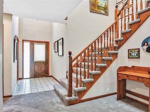 Tiled Entry with Soaring Ceiling and Skylights