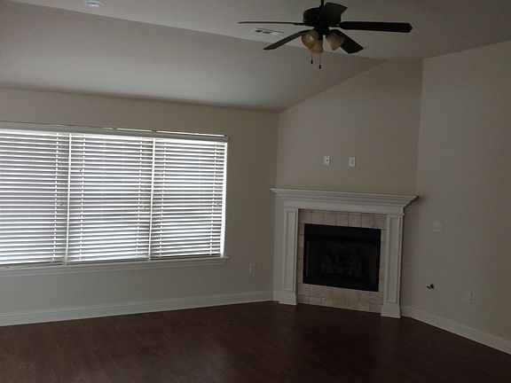 Den with gas fireplace.