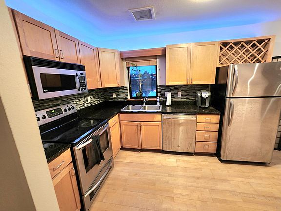 Kitchen with updated appliances. River view from window.