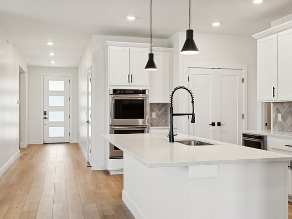 The foyer of the home opens up into the kitchen.