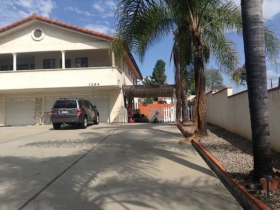 Unit for rent to the right, entry under patio