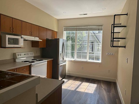 Kitchen with recently updated refrigerator and dishwasher