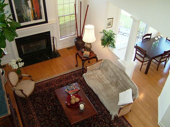 Living room w/ cathedral ceiling w/ skylight